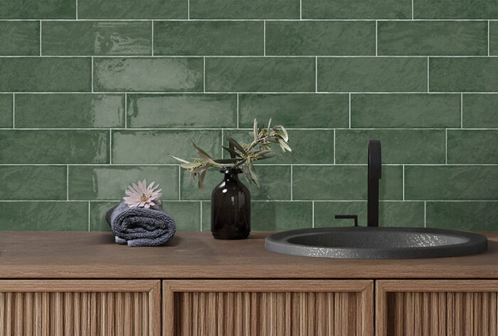 Bright bathroom featuring Solar Forest gloss green tiles and a contemporary sink, adding a touch of elegance to the space.