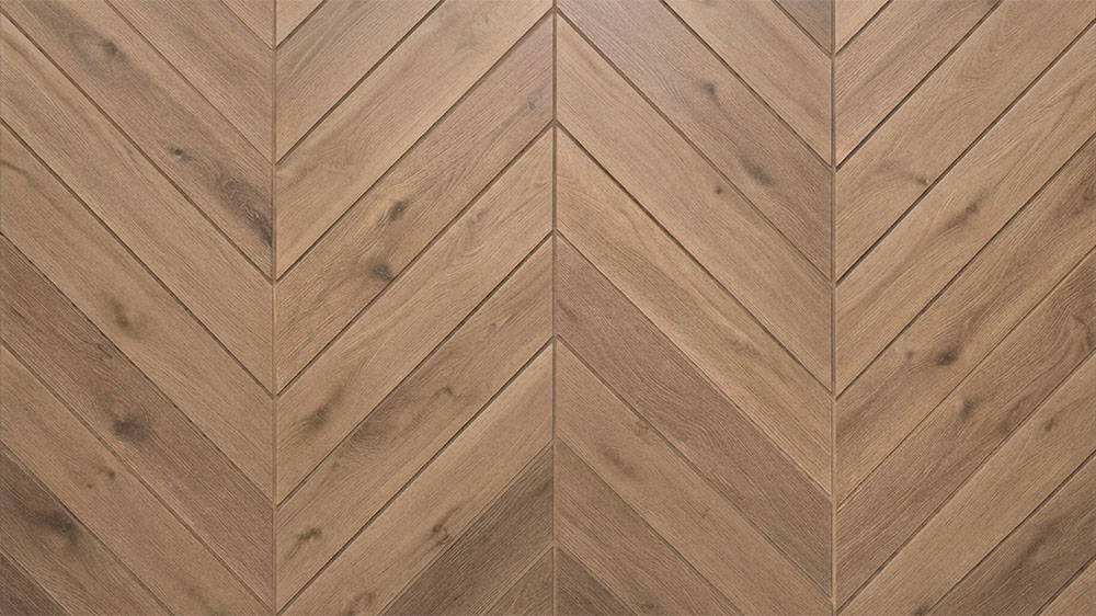 Chevron tile pattern with angled tiles meeting at sharp points to create a continuous V-shaped design.
