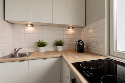 Classic white bevelled edge tiles highlighted in contemporary kitchen