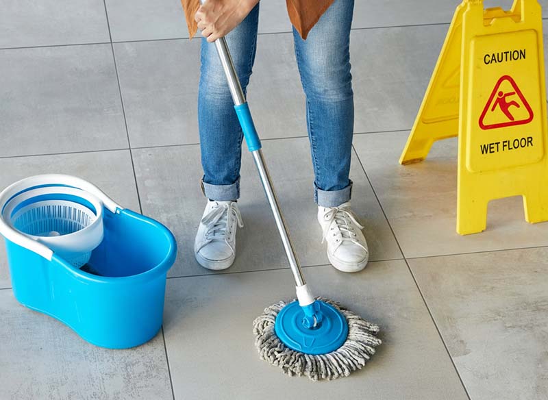 General tile cleaning using a mop and gentle cleaner to maintain surface appearance