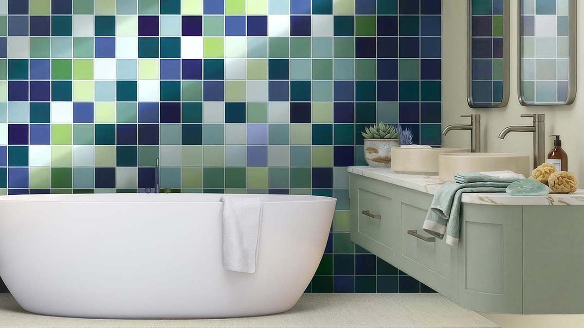 Coastal bathroom design featuring calming blue and green toned Spectrum range tiles inspired by ocean and nature