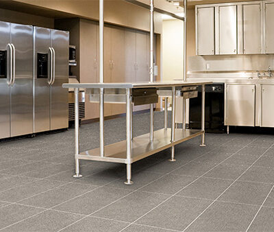 Industrial kitchen with heavy-duty P5 R12 tiles providing maximum grip in wet and greasy conditions.