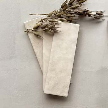 Light ivory tiles with a smooth neutral finish
