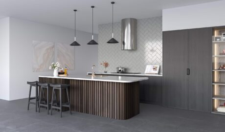 A contemporary kitchen with a spacious island and bar stools, showcasing the new range Twilight tiles.