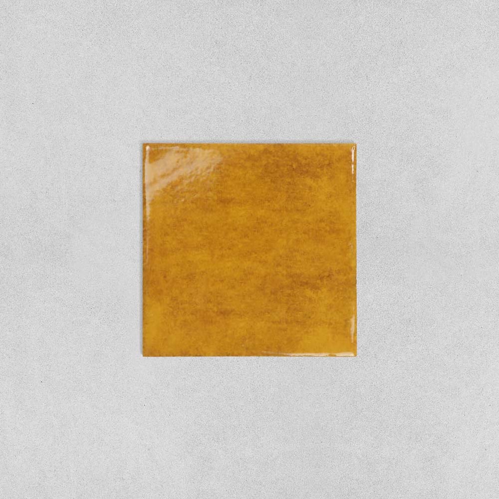 Solar Amber wall tiles featuring rich amber colouring and glossy handcrafted appearance