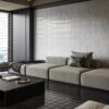 A sleek lounge room featuring stylish black and white tiles, creating a modern and inviting atmosphere.