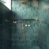 Fully tiled shower featuring decorative wall and floor tiles