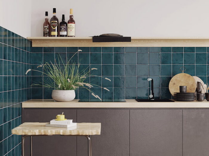 A charming kitchen adorned with blue tiles and a table, complemented by a contemporary Solar Pacific Gloss splashback.