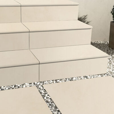 Stairway with non-slip tiled treads and landings rated P4 R11, designed for safety in wet or sloped areas.