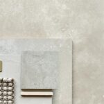 Travertine-look tiles showcasing natural veining and soft neutral tones.