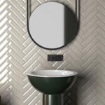 Vintage aesthetic tiled bathroom with retro-inspired patterns.